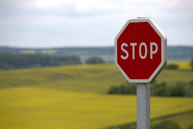stop sign in pasture